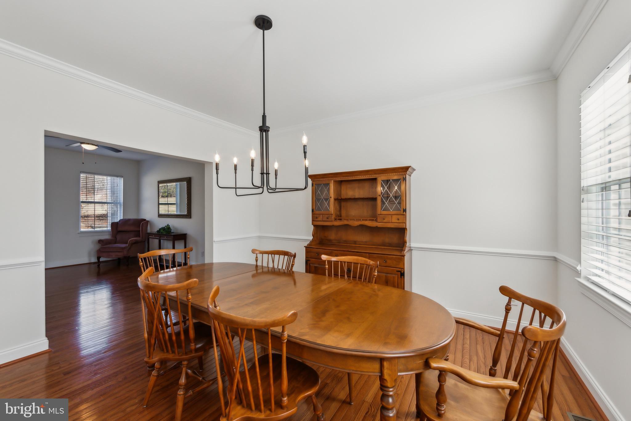 684 Highspire Road Glenmoore, PA 19343 - Photo 8 of 46 a view of a dining room with furniture window and wooden floor