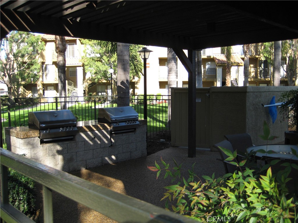 2085 Highpointe Drive Corona, CA 92879 - Photo 13 of 17 a living room filled with furniture and a potted plant