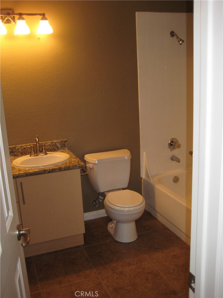 2085 Highpointe Drive Corona, CA 92879 - Photo 4 of 17 a bathroom with a sink toilet and shower