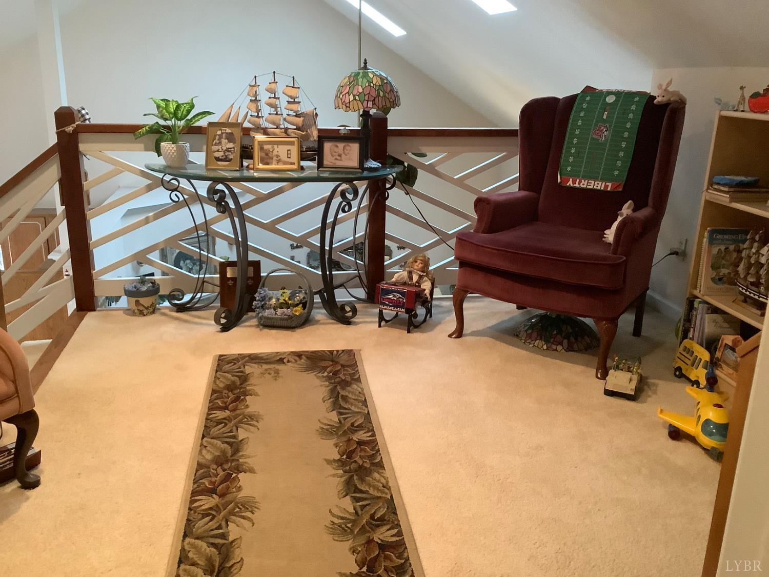 1564 Calohan Road Rustburg, VA 24588 - Photo 22 of 29 a living room with furniture and a wooden floor