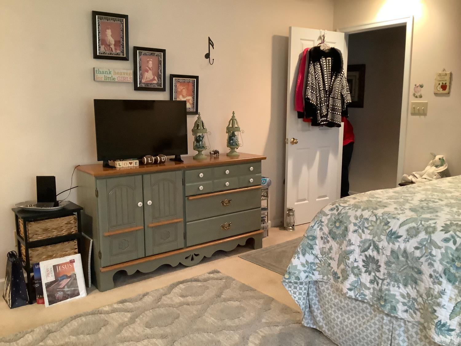 1564 Calohan Road Rustburg, VA 24588 - Photo 9 of 29 a bedroom with a bed and flat screen tv