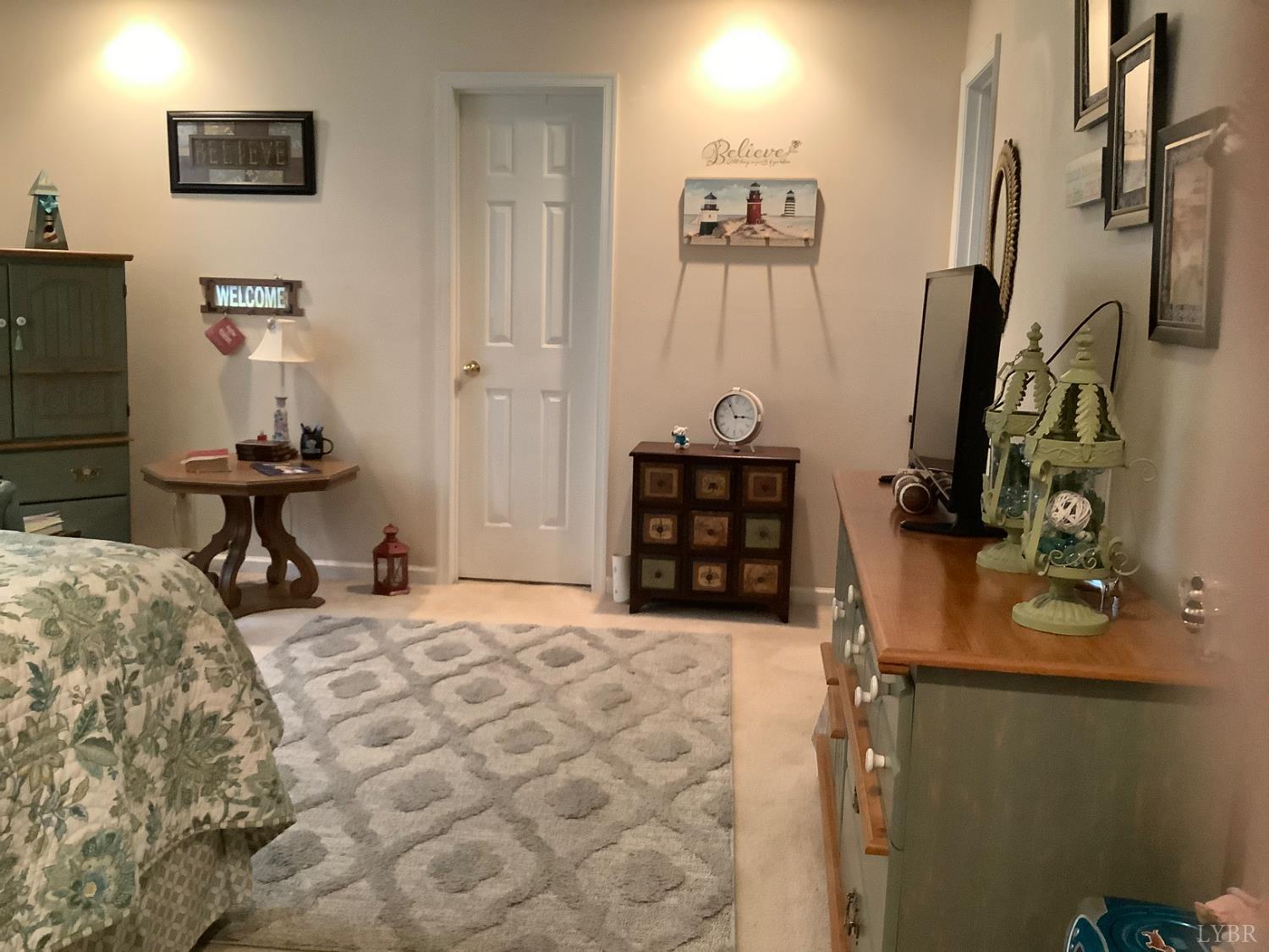 1564 Calohan Road Rustburg, VA 24588 - Photo 10 of 29 a bedroom with furniture and a bed