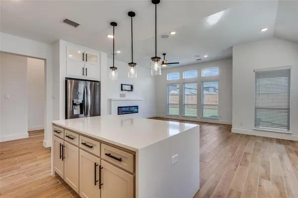 a view of kitchen with a sink and wooden floor