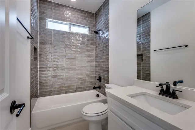 a bathroom with a sink a toilet and a bathtub