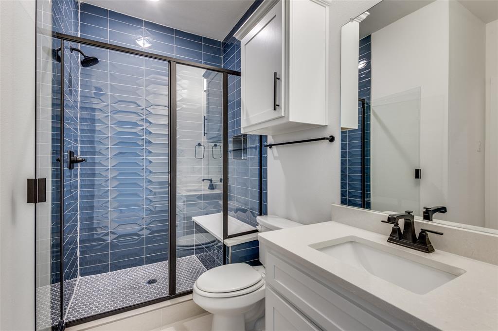 3308 Lakestriker Road Pilot Point, TX 76258 - Photo 19 of 25 a bathroom with a sink toilet and shower