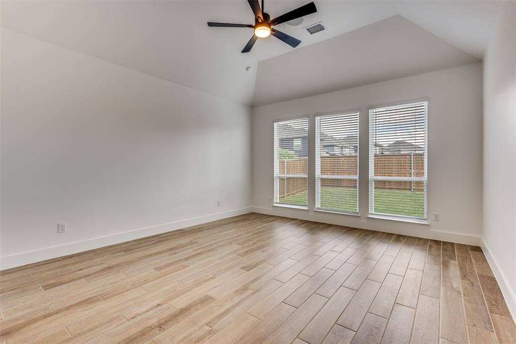 3308 Lakestriker Road Pilot Point, TX 76258 - Photo 20 of 25 wooden floor in an empty room with a window