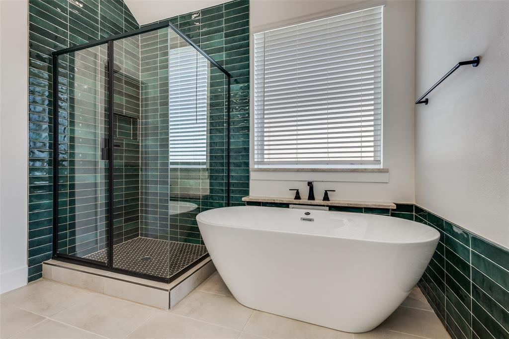 3308 Lakestriker Road Pilot Point, TX 76258 - Photo 23 of 25 a white bath tub sitting in a bathroom next to a window