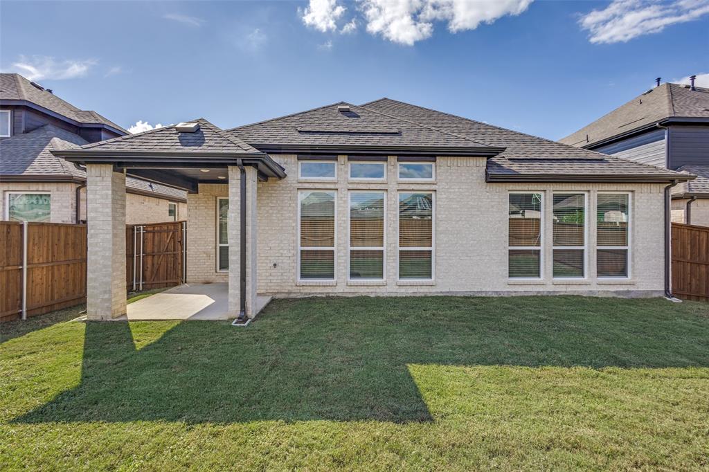 3308 Lakestriker Road Pilot Point, TX 76258 - Photo 25 of 25 a view of a house with backyard and garden