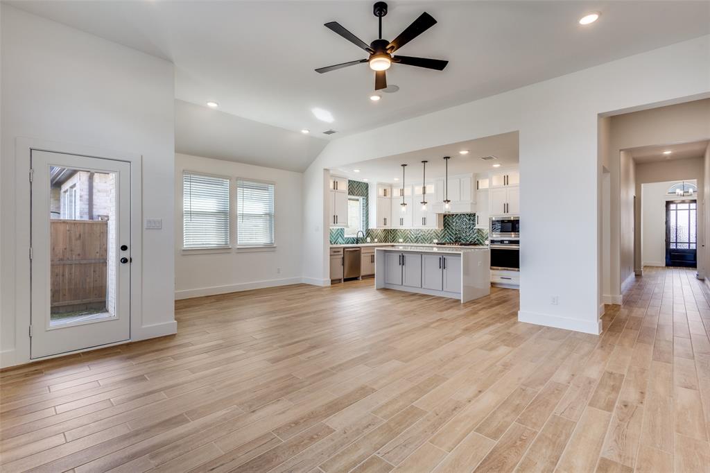 3308 Lakestriker Road Pilot Point, TX 76258 - Photo 7 of 25 a view of a kitchen with wooden floor and a kitchen