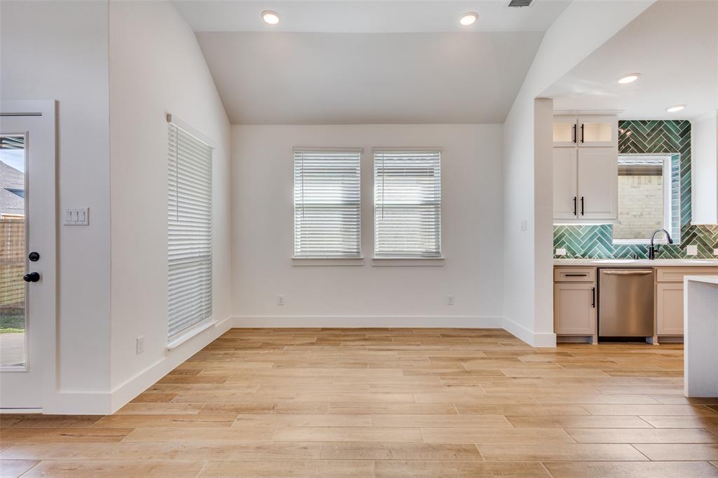 3308 Lakestriker Road Pilot Point, TX 76258 - Photo 8 of 25 an empty room with wooden floor and windows