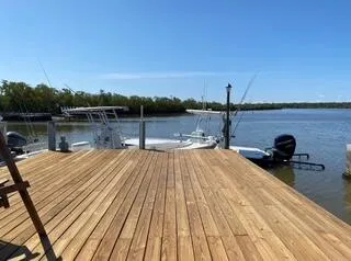 a view of a lake with wooden floor and city view