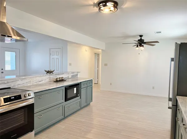 a kitchen with a stove and a sink