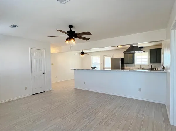 a view of a kitchen with a sink and cabinet area