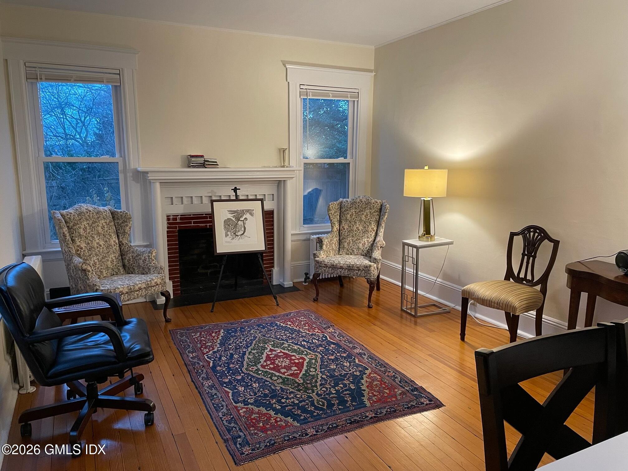 90 Riverside Avenue, Unit 1 Riverside, CT 06878 - Photo 3 of 10 a living room with furniture and a fireplace