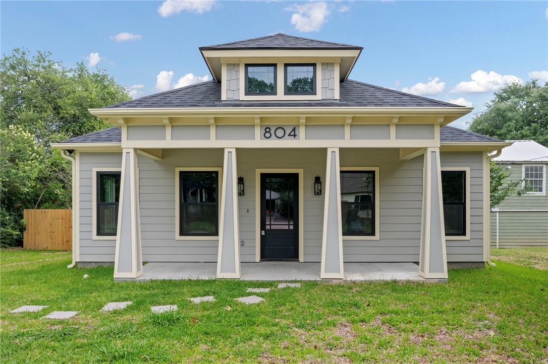 804 East 27th Street Bryan, TX 77803 - Photo 1 of 21 a front view of a house with a yard