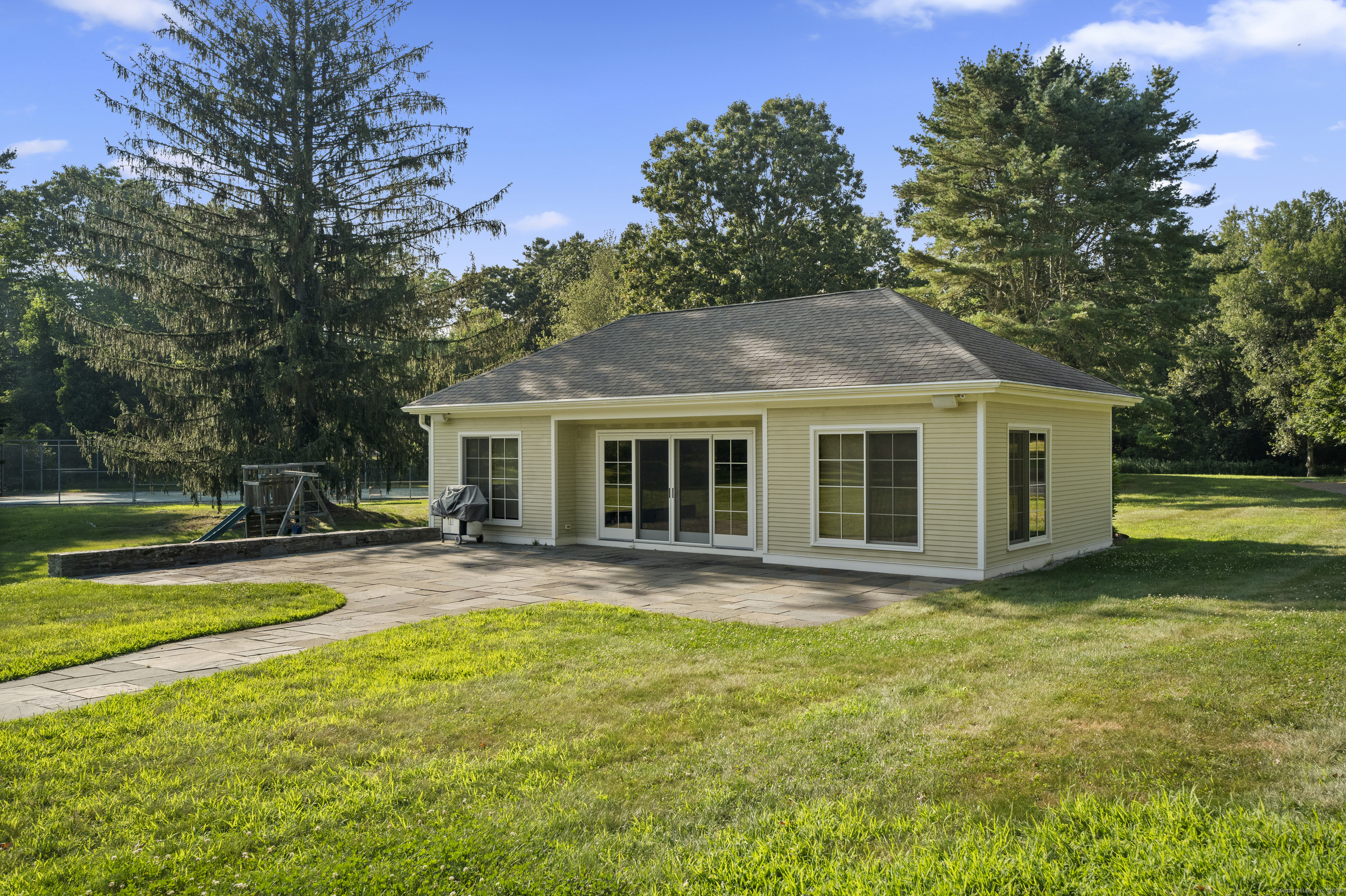 455 Stonington Road Stonington, CT 06378 - Photo 29 of 39 a view of a house with a yard and sitting area