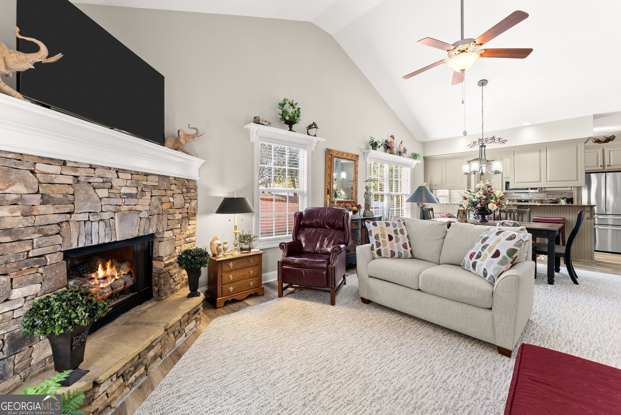 92 Colonial Drive, Unit 1 Cleveland, GA 30528 - Photo 13 of 43 a living room with furniture a fireplace and a chandelier
