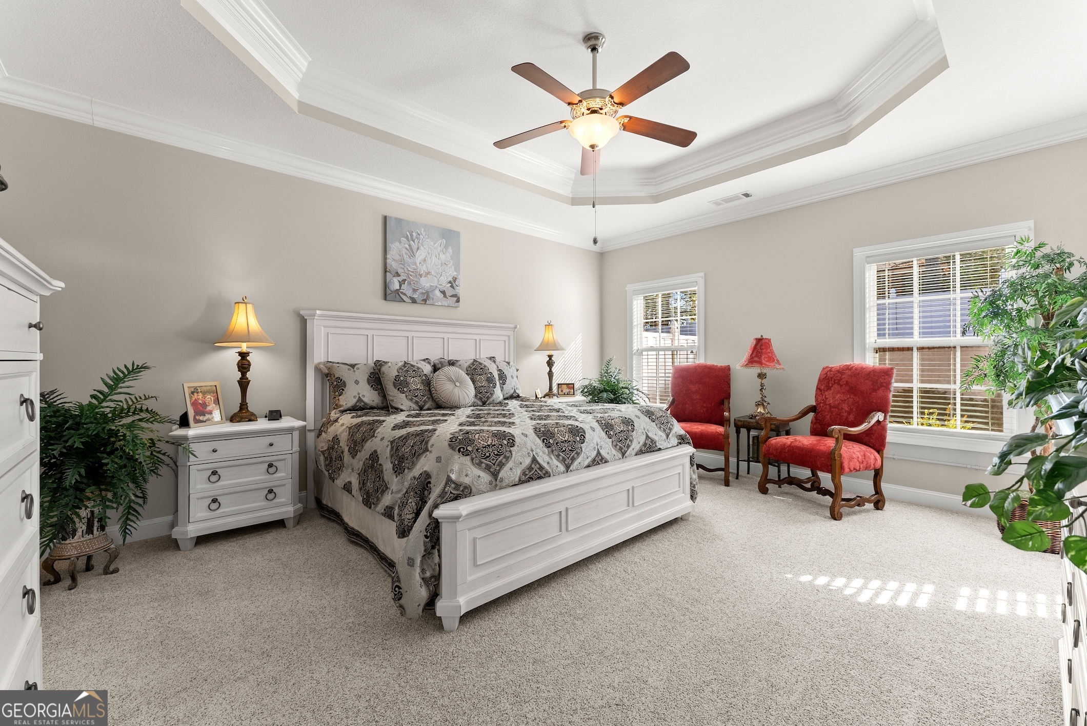 92 Colonial Drive, Unit 1 Cleveland, GA 30528 - Photo 15 of 43 a spacious bedroom with a bed and a chandelier