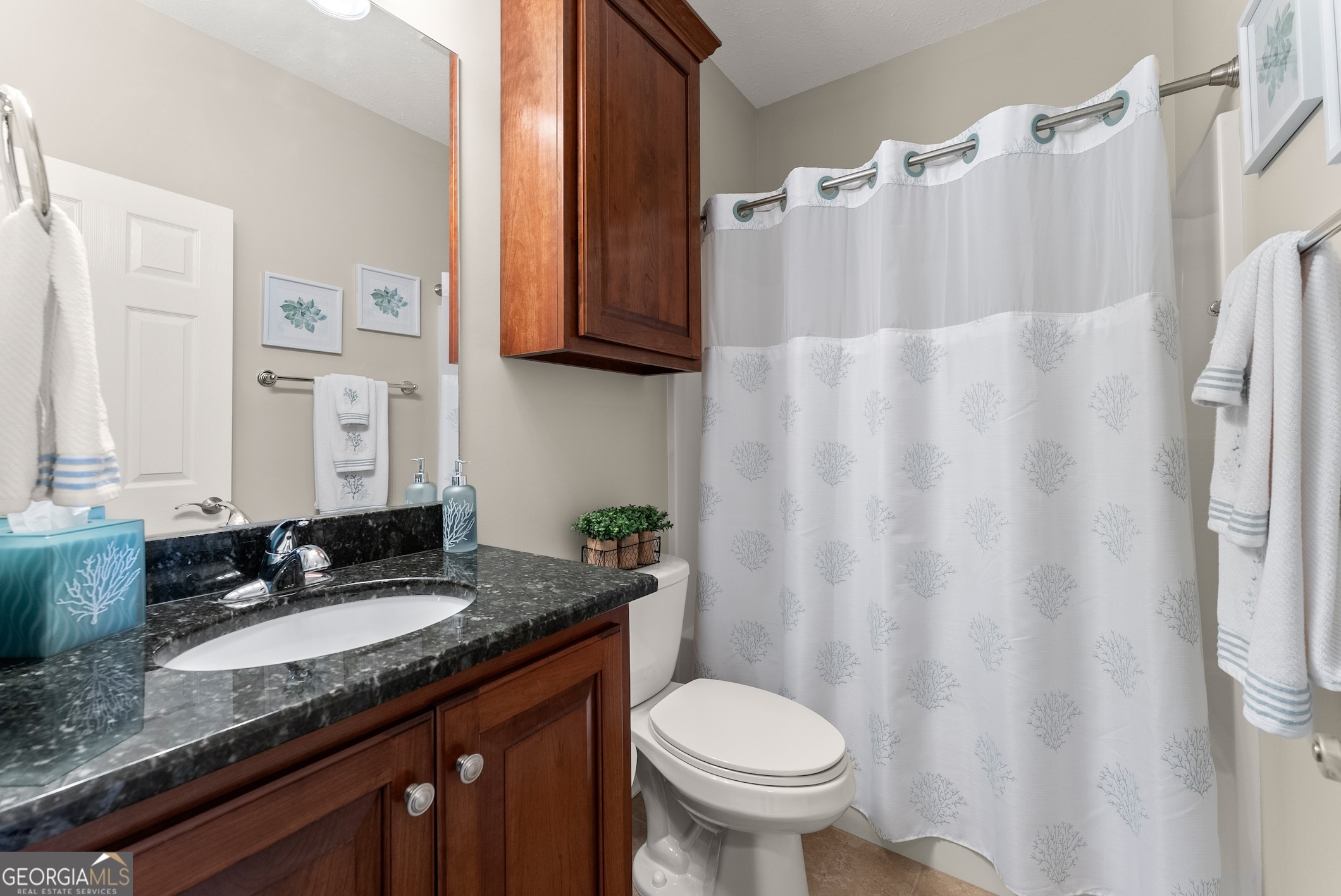 92 Colonial Drive, Unit 1 Cleveland, GA 30528 - Photo 23 of 43 a bathroom with a granite countertop sink and a mirror