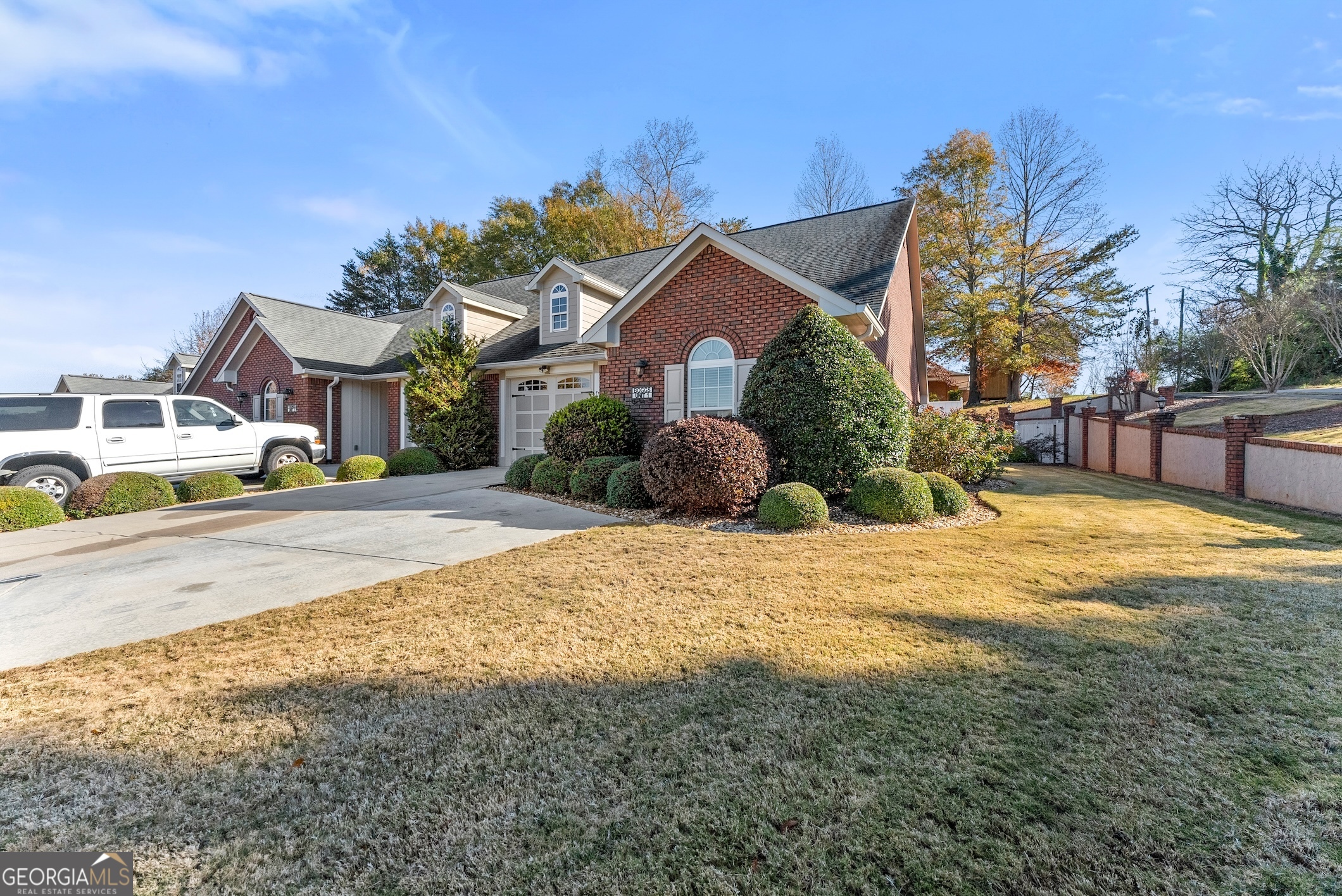 92 Colonial Drive, Unit 1 Cleveland, GA 30528 - Photo 34 of 43 a front view of a house with a yard and garage