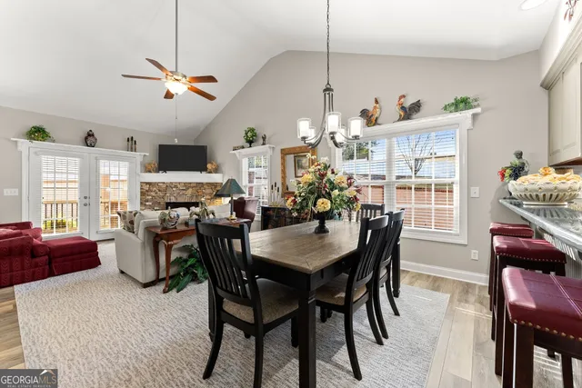 a view of a dining room with furniture window and outside view