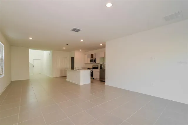 a view of a kitchen with a sink and cabinets