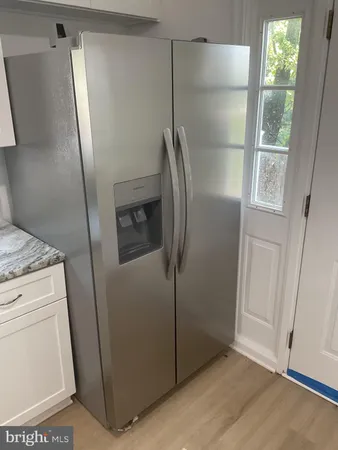 a stove top oven sitting inside of a kitchen
