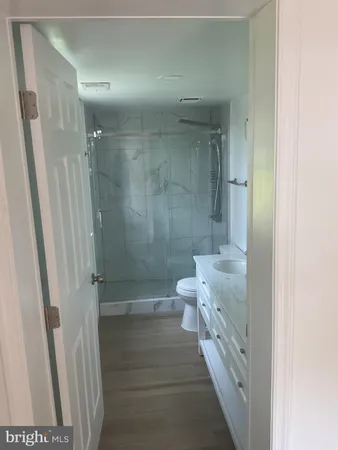 a bathroom with a shower and a toilet