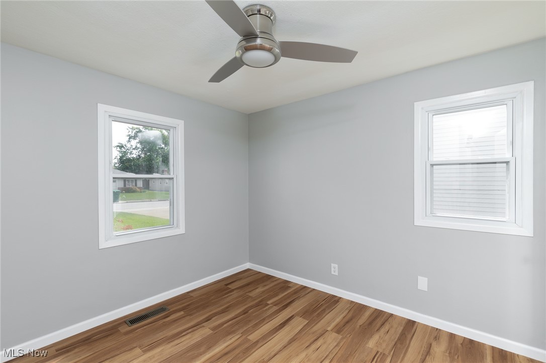 4782 Belle Meadow Road Mentor, OH 44060 - Photo 18 of 22 Spare room featuring ceiling fan and hardwood / wood-style flooring