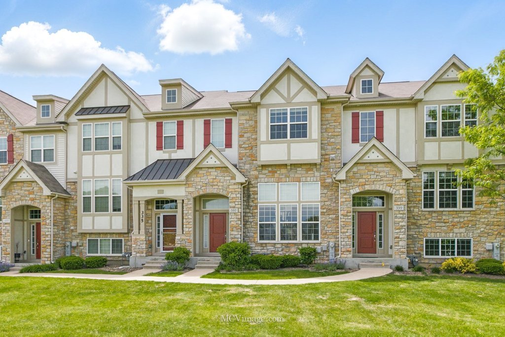337 Bennett Drive Carol Stream, IL 60188 - Photo 1 of 1 a front view of a residential apartment building with a yard