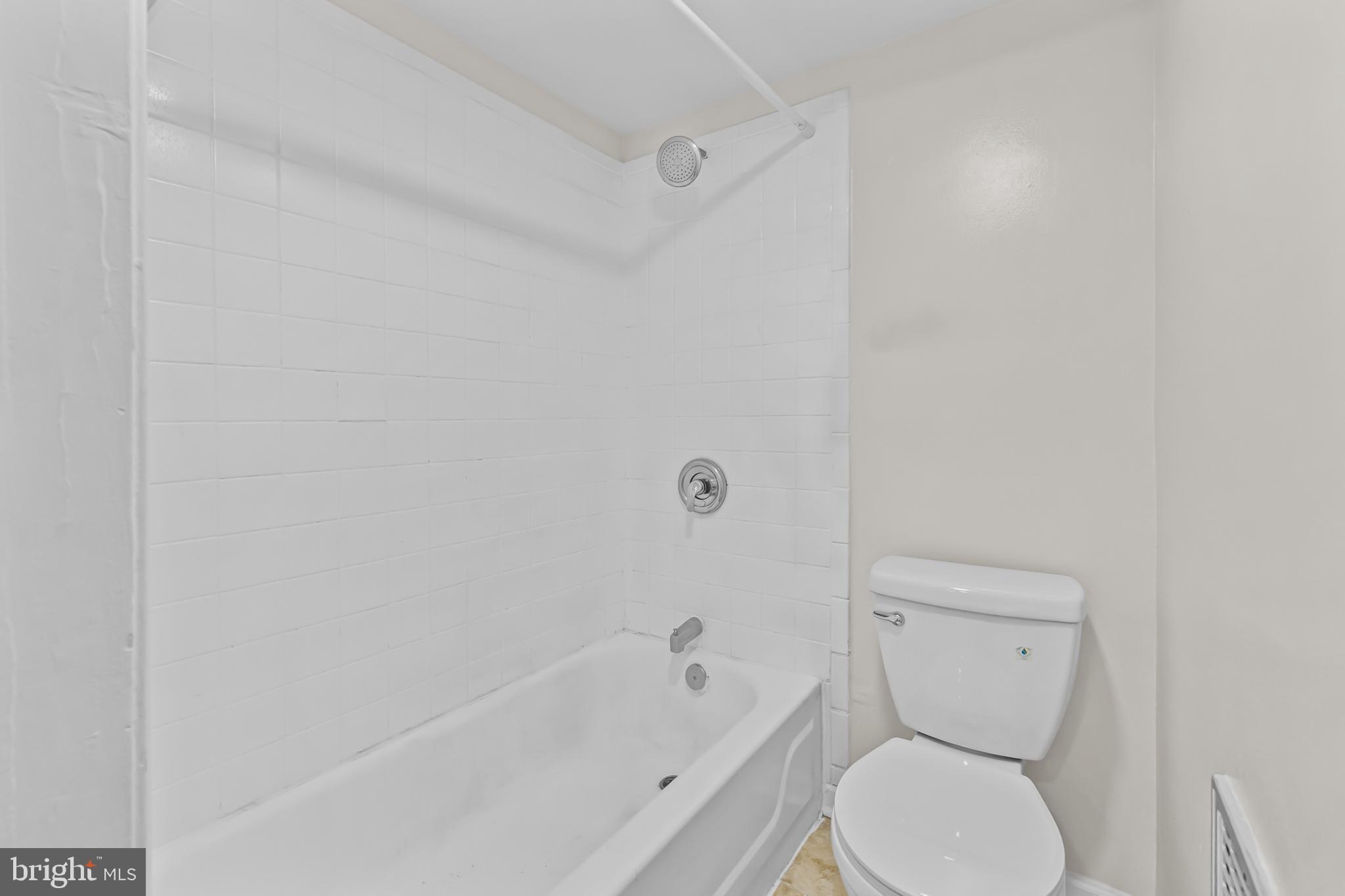 2032 15th Street Northwest, Unit 2 Washington, DC 20009 - Photo 15 of 28 a bathroom with a toilet and a bathtub