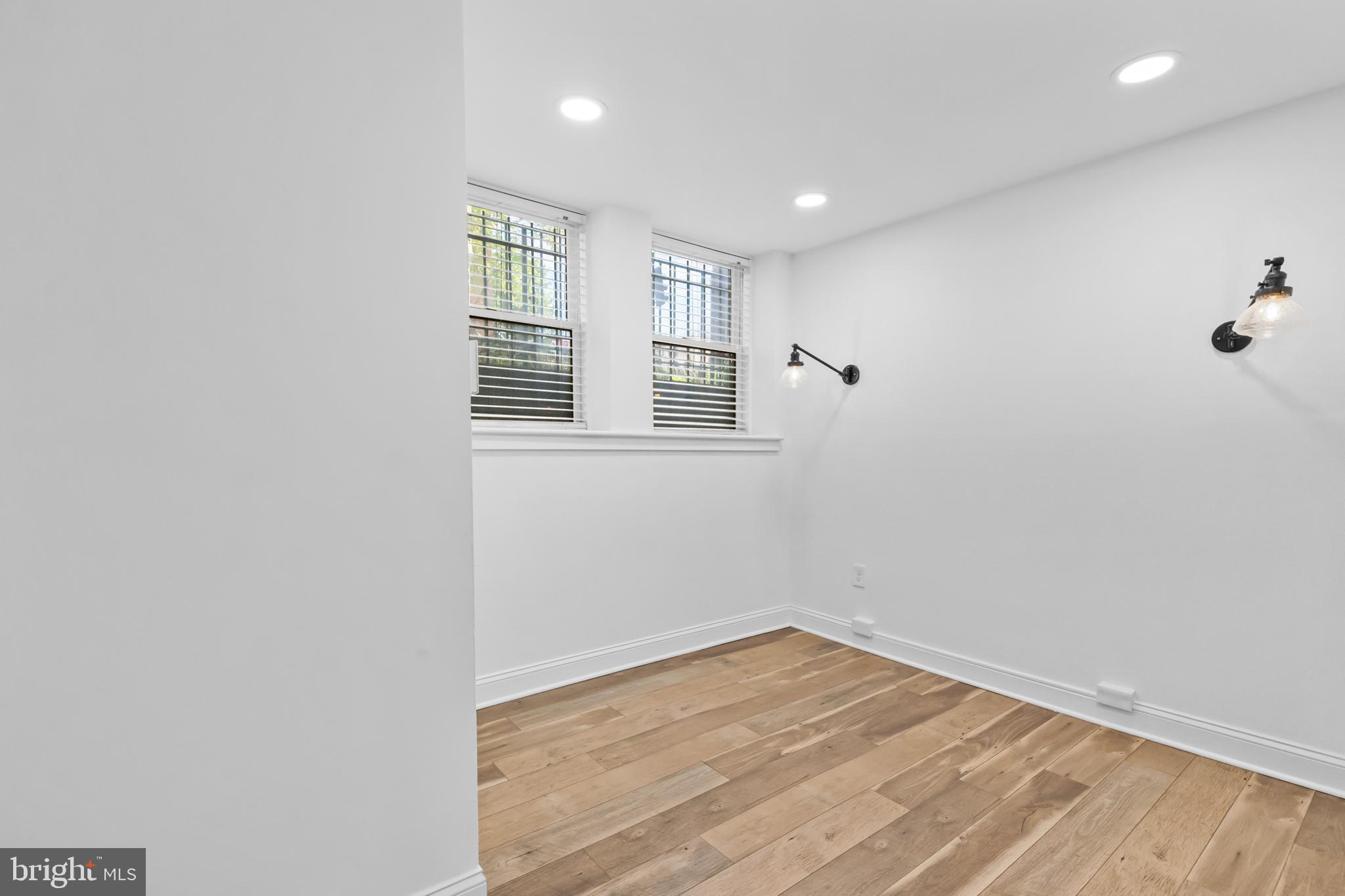 2032 15th Street Northwest, Unit 2 Washington, DC 20009 - Photo 17 of 28 wooden floor in an empty room with a window