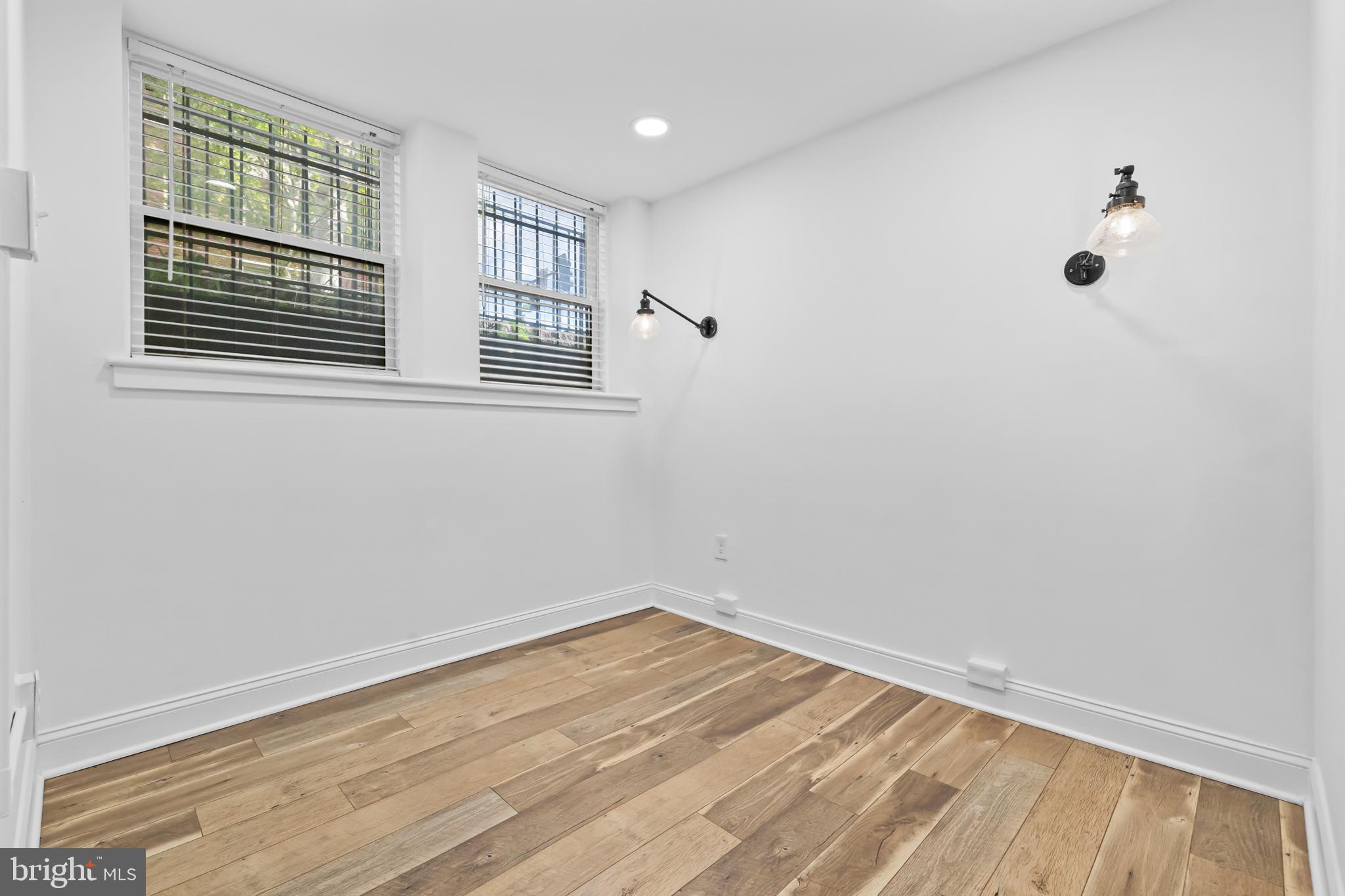 2032 15th Street Northwest, Unit 2 Washington, DC 20009 - Photo 19 of 28 a view of empty room with wooden floor and windows