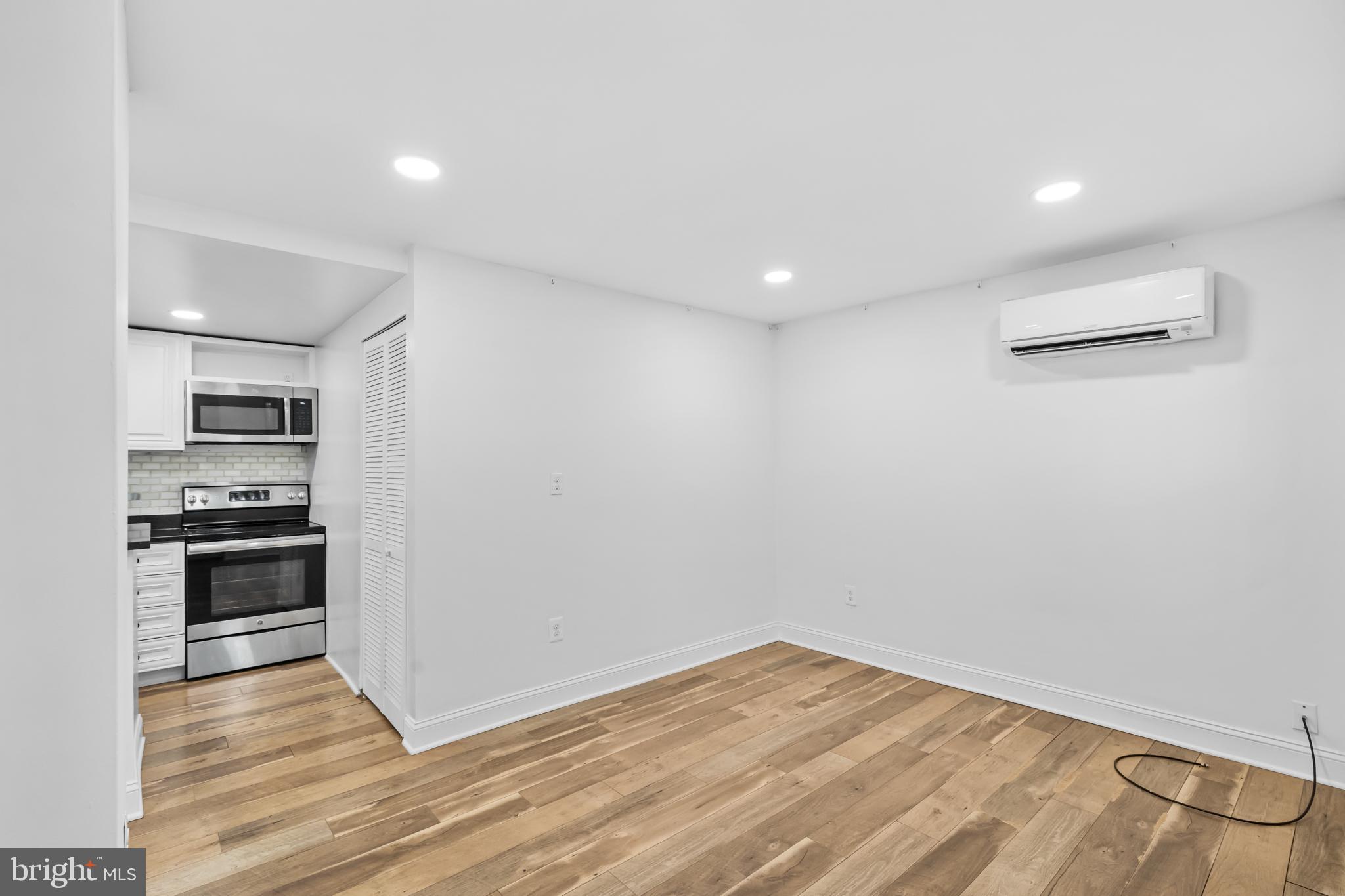 2032 15th Street Northwest, Unit 2 Washington, DC 20009 - Photo 5 of 28 a view of kitchen with stainless steel appliances wooden floor and window