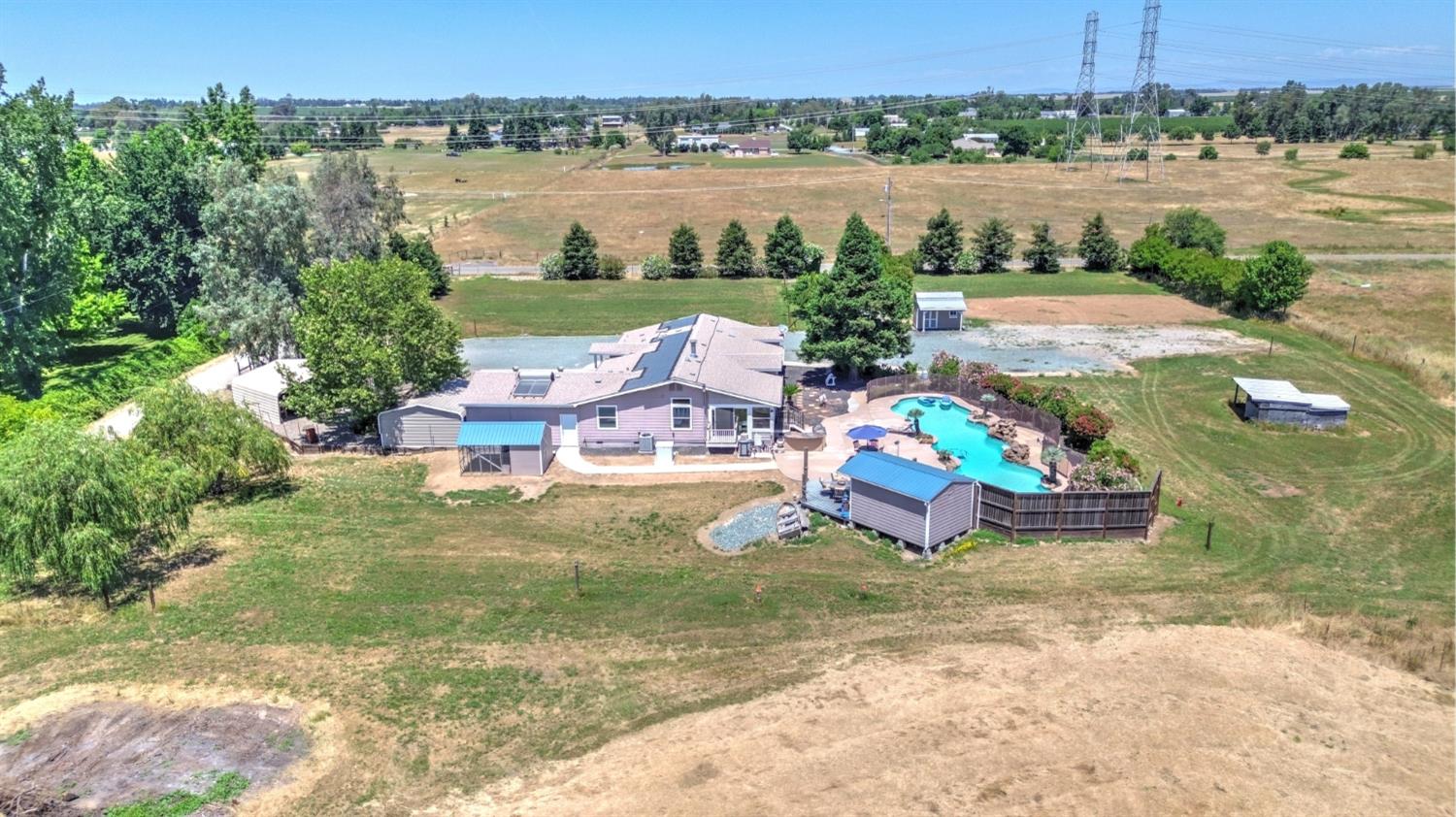 12390 Hobday Road Wilton, CA 95693 - Photo 89 of 92 an aerial view of a house with outdoor space and lake view