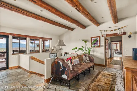 a living room with furniture and a rug