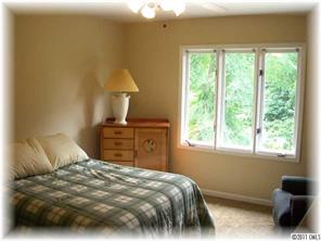 8406 Fairfield Forest Road Denver, NC 28037 - Photo 11 of 16 a bedroom with a bed and a window