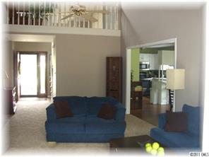 8406 Fairfield Forest Road Denver, NC 28037 - Photo 2 of 16 a living room with furniture and a couch