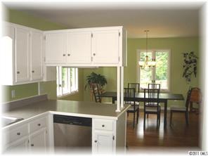 8406 Fairfield Forest Road Denver, NC 28037 - Photo 6 of 16 a kitchen with a window a sink and cabinets