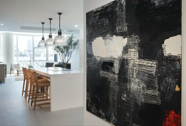 a kitchen with a table and chairs in it