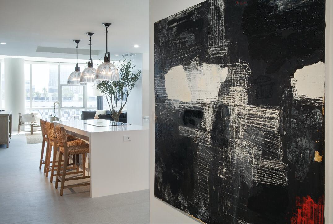 851 Northeast 1st Avenue, Unit 812 Miami, FL 33132 - Photo 1 of 84 a kitchen with a table and chairs in it