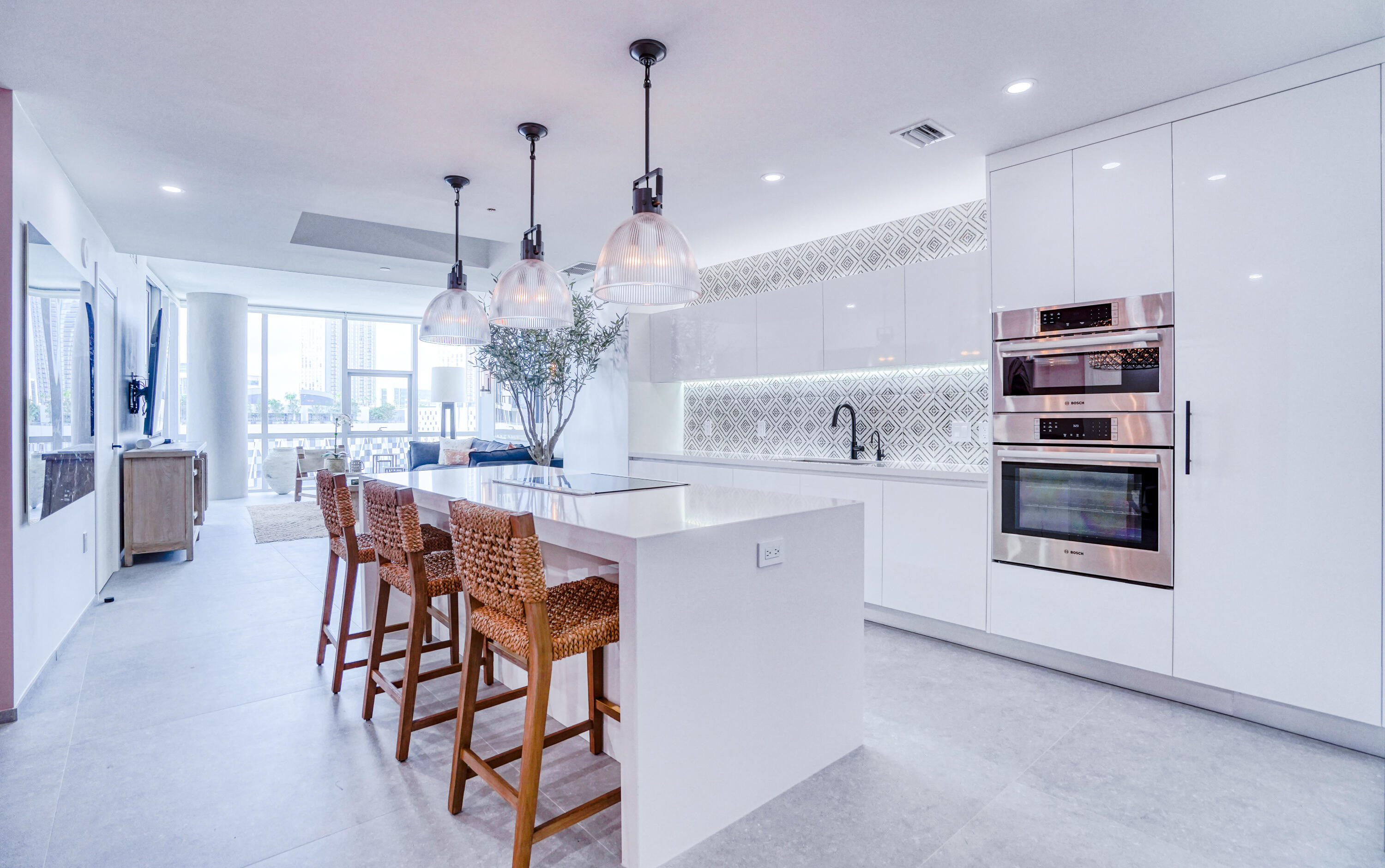 851 Northeast 1st Avenue, Unit 812 Miami, FL 33132 - Photo 23 of 84 a kitchen with stainless steel appliances kitchen island granite countertop a sink and cabinets