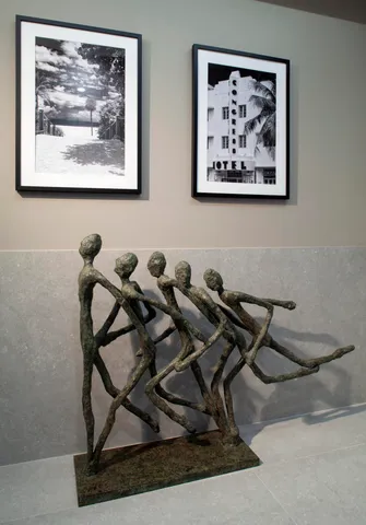 a living room with furniture window and a flat screen tv