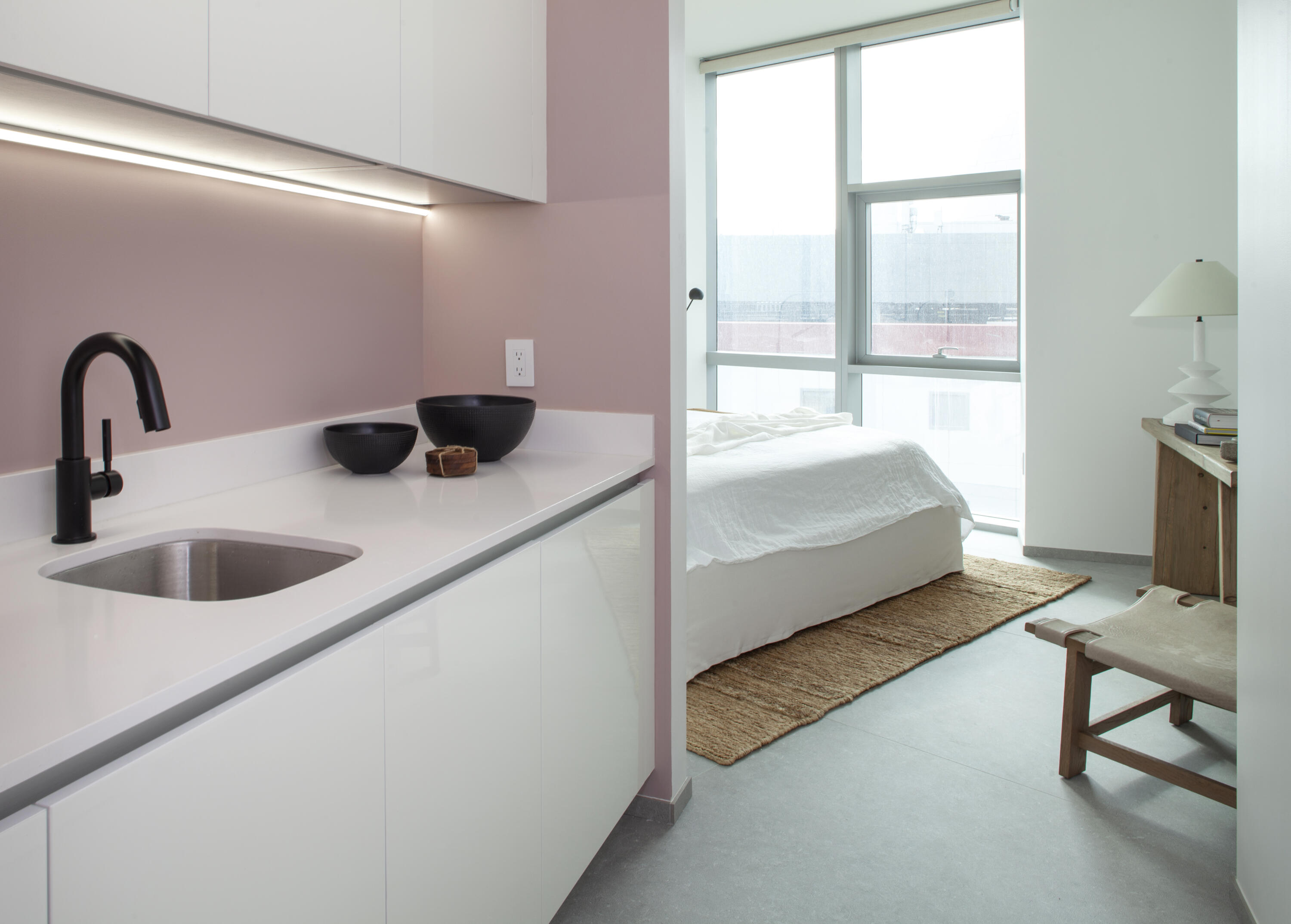 851 Northeast 1st Avenue, Unit 812 Miami, FL 33132 - Photo 41 of 84 a bedroom with a bed and large window