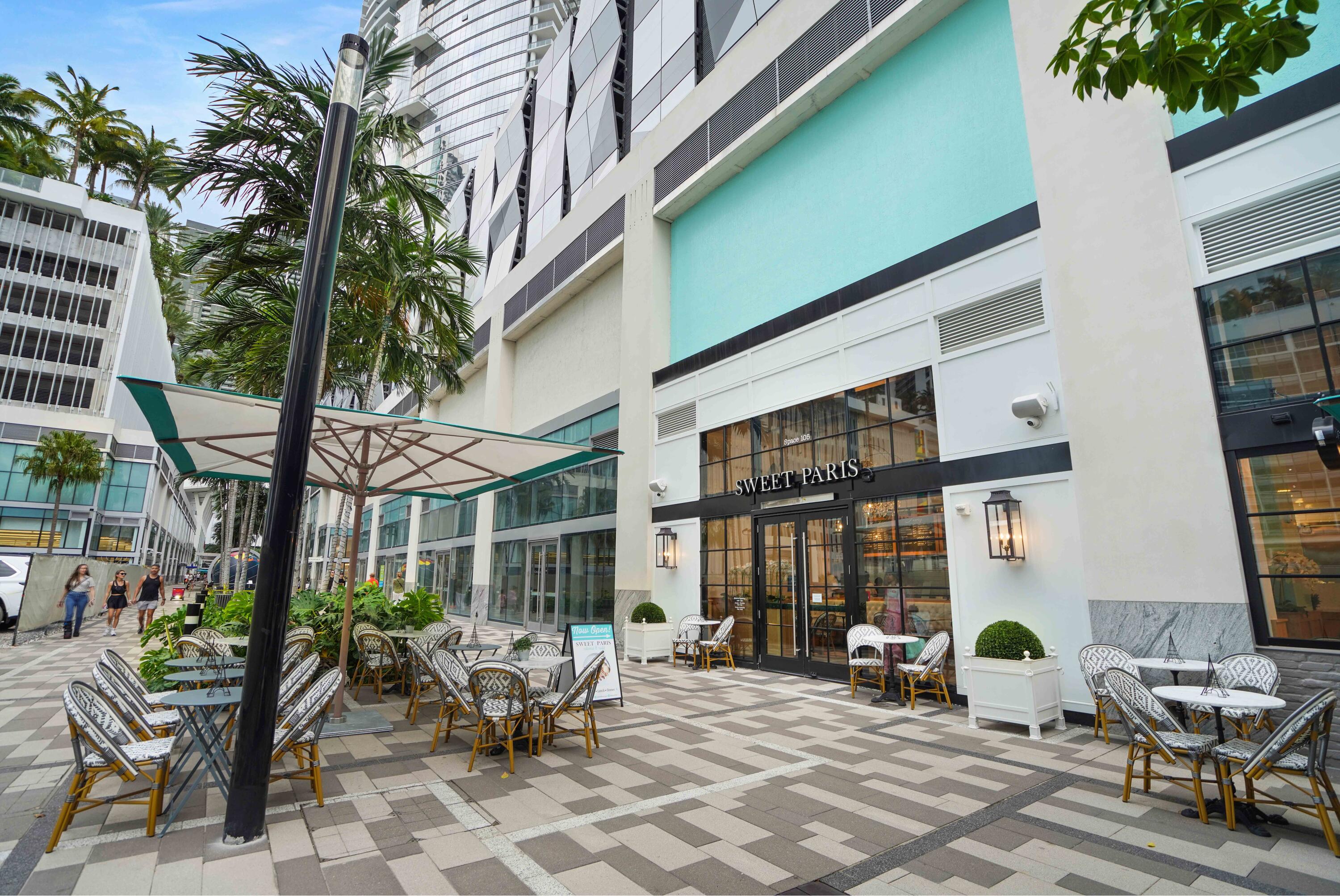 851 Northeast 1st Avenue, Unit 812 Miami, FL 33132 - Photo 68 of 84 a view of a patio with couple of chairs and potted plants