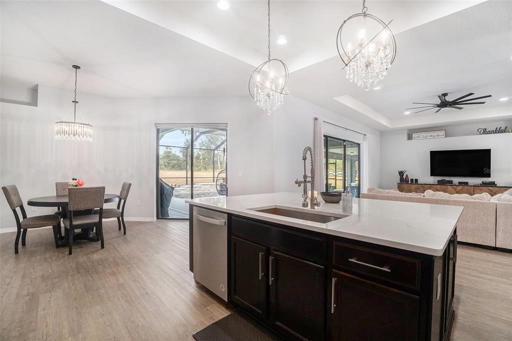 7403 Northeast 22nd Ct Road Ocala, FL 34479 - Photo 12 of 37 a kitchen with a table and chairs in it