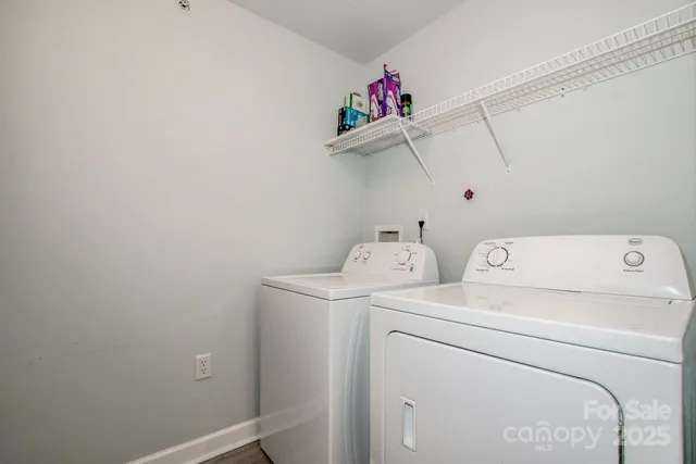 a view of a house with a yard patio and swimming pool