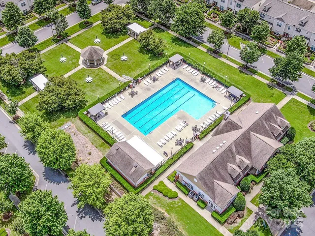 an aerial view of a house with a lake view