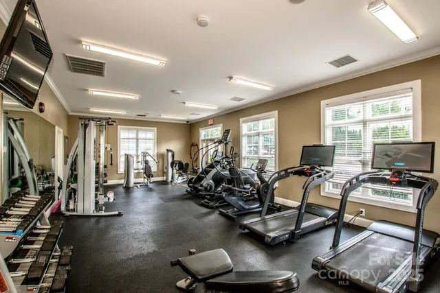 a view of a sign in front of flowers