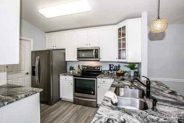 a kitchen with a stove and a microwave